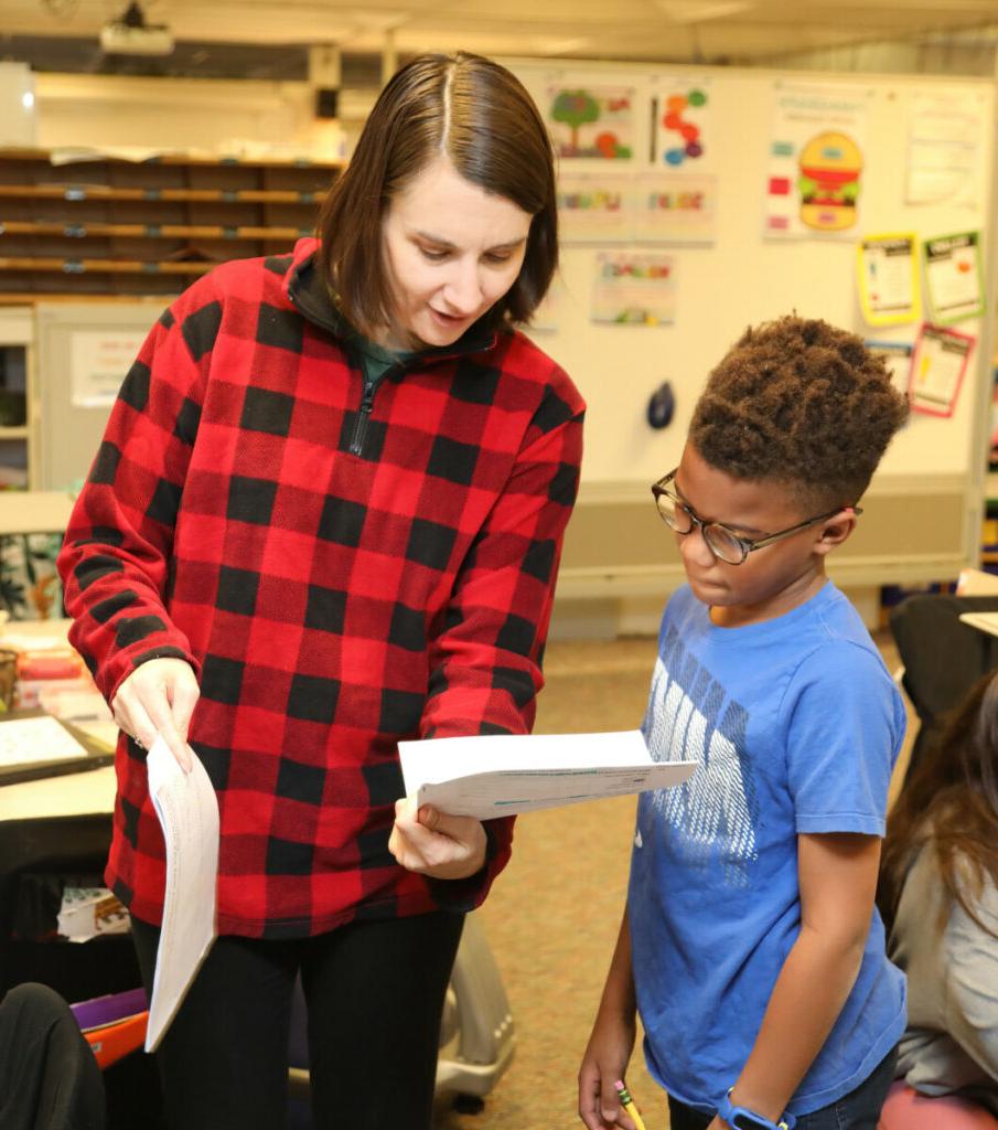 2 students sharing a paper together